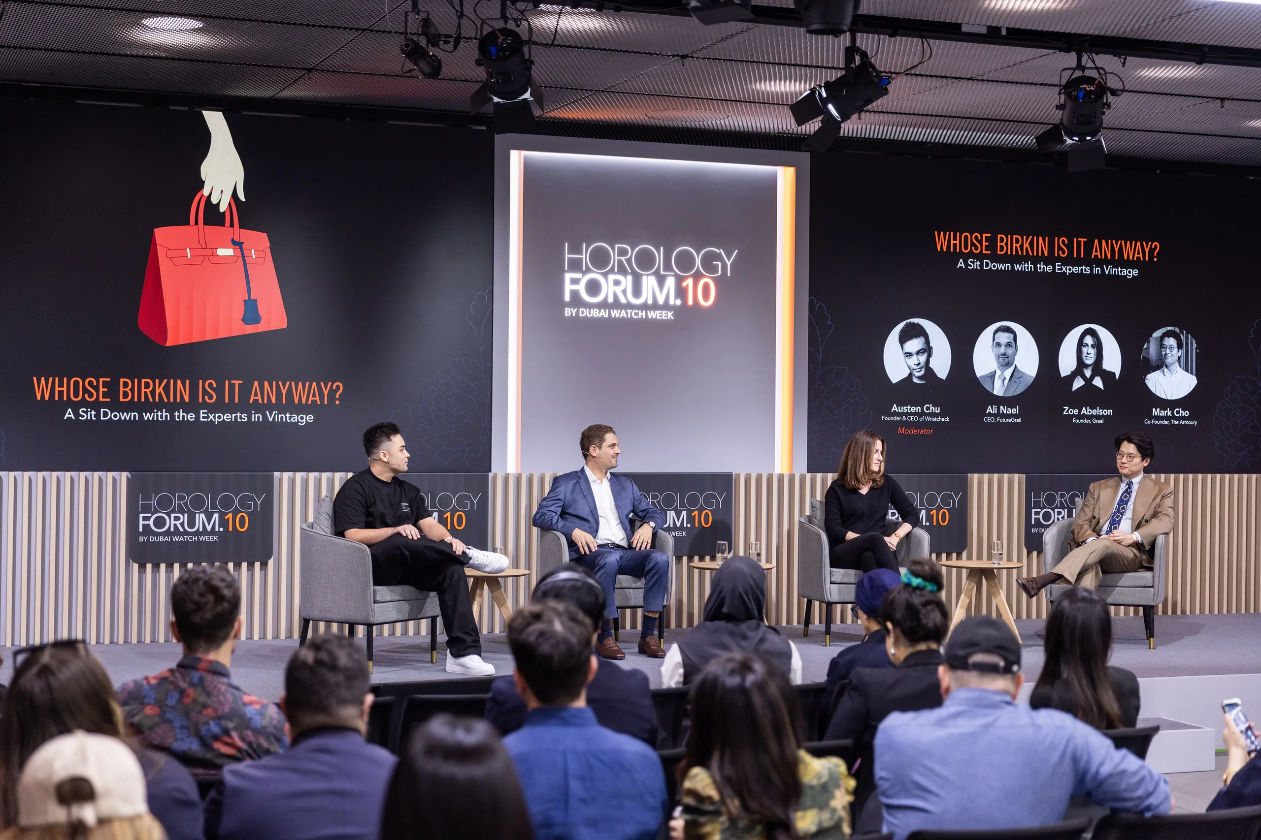 Panel discussion on the Horology Forum 10 stage in Hong Kong, with branded screens and an audience