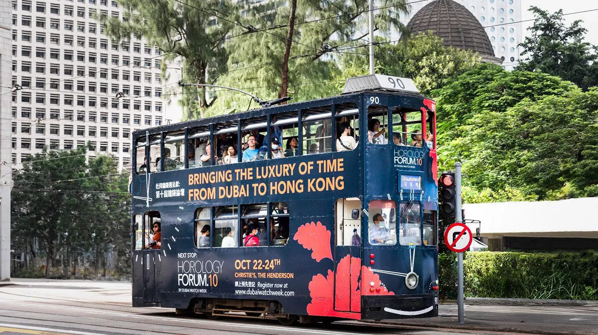 Hong Kong tram wrapped in Horology Forum 10 branding: “Bringing the luxury of time from Dubai to Hong Kong”